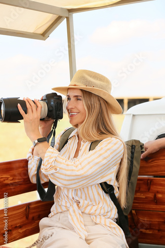 Beautiful female tourist wi...