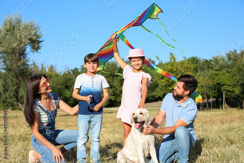 Happy family with cute dog ...