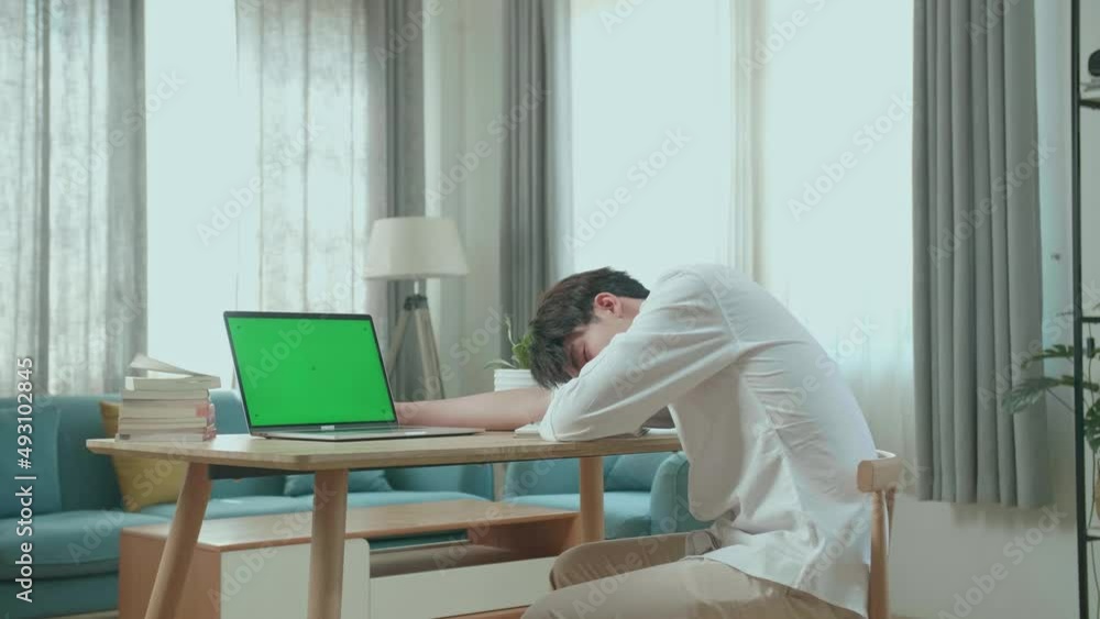 Side View Of Asian Man Student Sleeping While Using Green Screen Computer At Home
Side View Of Asian Man Student Sleeping While Using Green Screen Computer At Home