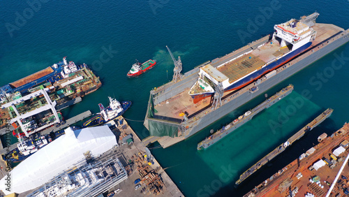 Aerial drone photo of shipyard in old port of Salamina island place where historic battle of Salamina took place, Attica, Greece © aerial-drone