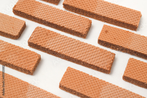 Pile of delicious chocolate wafers, on white background. photo