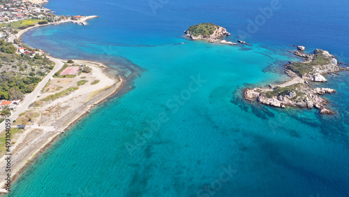 Aerial drone photo of small seaside village and small islets of Peristera with crystal clear turquoise sea ideal for quiet vacation close to Athens, Salamina island, Saronic Gulf, Greece © aerial-drone