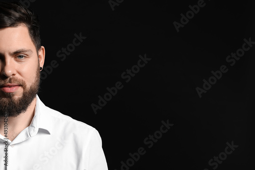Stylish bearded man on dark background