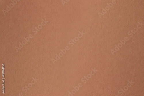 Brown paper background. Brown cardboard.