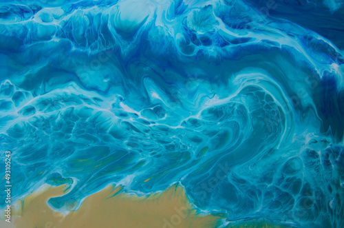 Epoxy resin art. Imitation of the sea. Sea foam. Modern trendy hobby. Macro photo. Modern hobby, handmade imitation of the sea wave and the beach