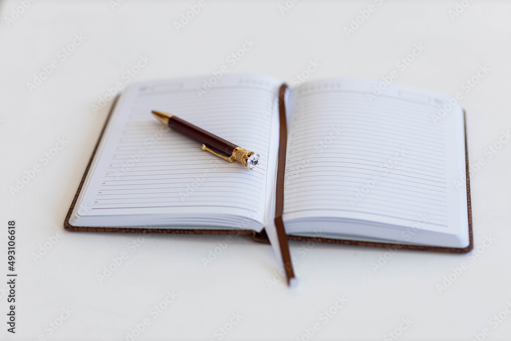 notepad and pen on the table notepad and pen on the table
