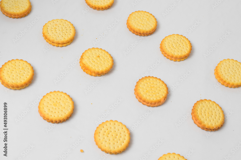 Fototapeta premium Cheese-flavored biscuits, photo from the top corner, isolated on a white background