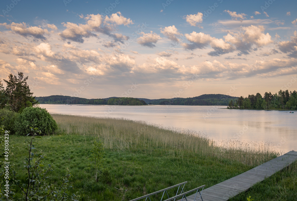 Panoramic landscape with evening lake. Nature conceptual image. Evening on the lake at summer. vintage picture. Panoramic landscape with evening lake. Nature conceptual image. Evening on the lake at summer. vintage picture.