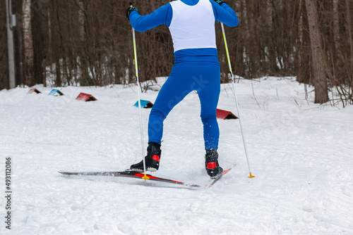 cross-country skiing in winter snow flies empty space number for inscription photo