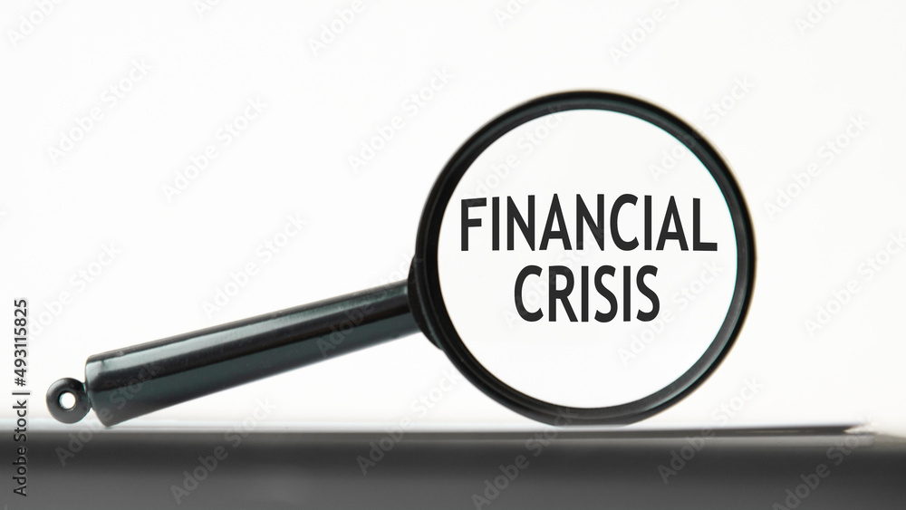 look closely and financial crisis with a magnifying glass. business concept. magnifying glass on the white background look closely and financial crisis with a magnifying glass. business concept. magnifying glass on the white background