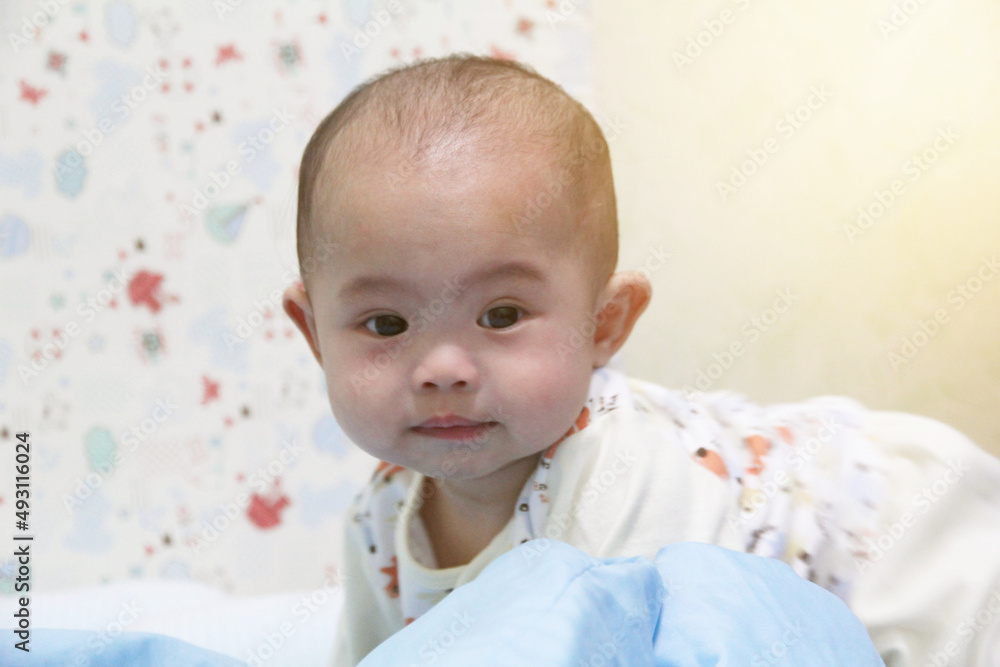 Baby crawling and look at camera in kid room Baby crawling and look at camera in kid room