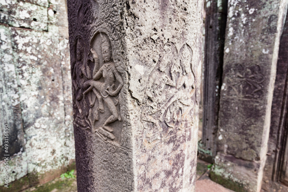 Apsara Dancers carved into a pillar at Angkor Thom in Siem Reap, Cambodia.