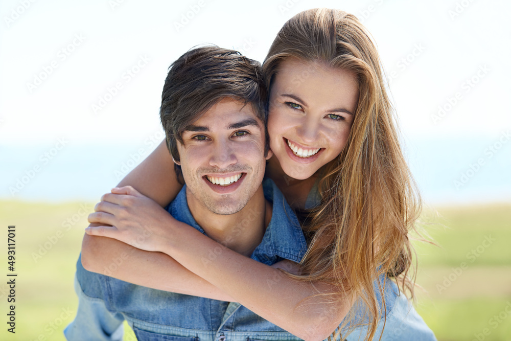Ahhhhh, young love. An affectionate young couple standing together in the outdoors. Ahhhhh, young love. An affectionate young couple standing together in the outdoors.