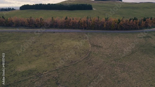 Road and Hill in French Lowland by Drone Under Clouds