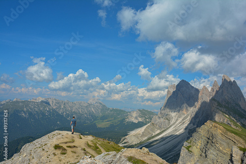 Man on mountain, Seceda ridgeline, Dolomites, italy