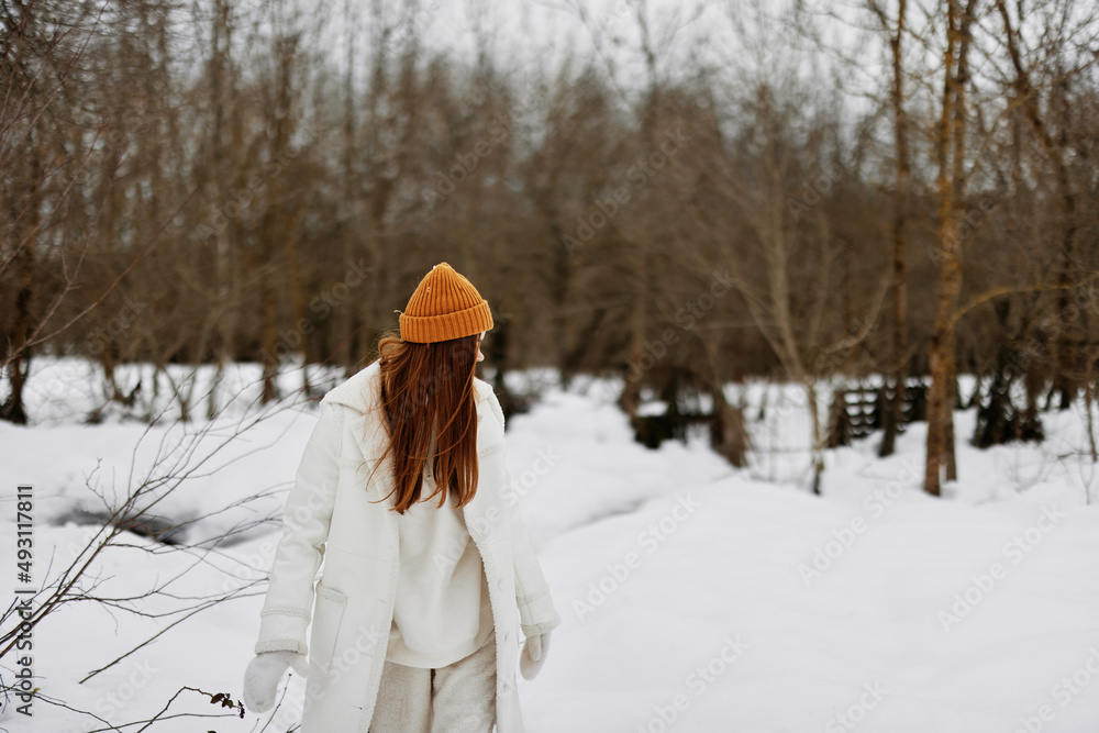 Happy young woman Walk in winter field landscape outdoor entertainment winter holidays Happy young woman Walk in winter field landscape outdoor entertainment winter holidays