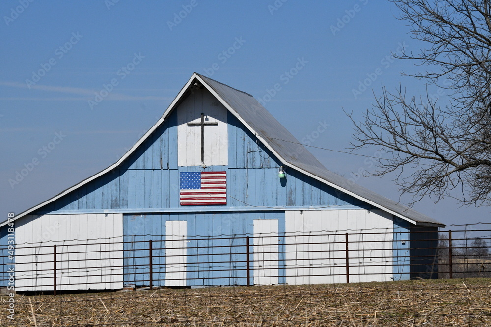 Blue Barn with a Cross and an American Flag