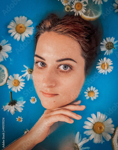 Pretty white women glamour portrait  with flower - stock photo  photo