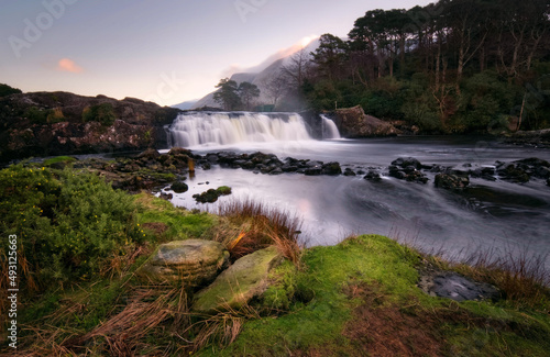 Obraz na płótnie Beautiful nature scenery with waterfall on river Erriff with mountains in the background at Aesleagh, county Mayo, Ireland w salonie