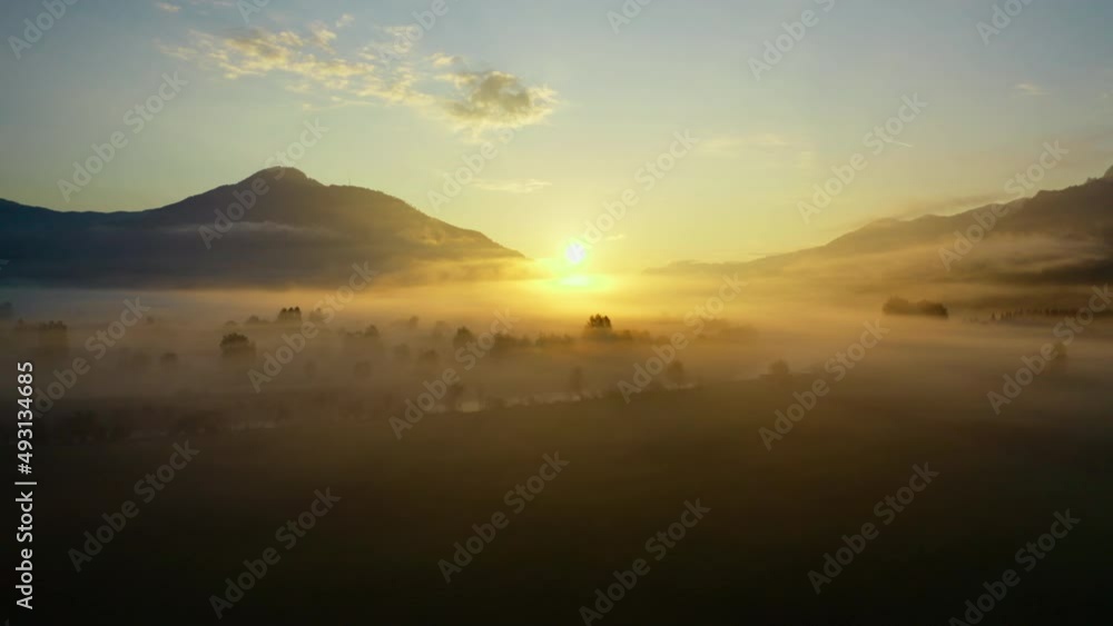 Drone Over Ethereal Misty Landscape Of Zell Am See Towards Sunrise Drone Over Ethereal Misty Landscape Of Zell Am See Towards Sunrise