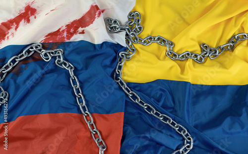 flags of russia and Ukraine with a metal chain