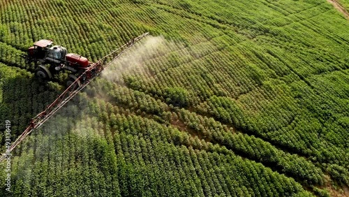 Tractor spraying soybean plantation in Brazil