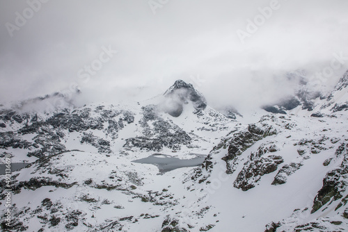 White Snowy Mountains Covered in Fog