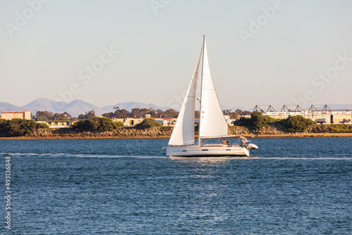 Sailboat across blue water
