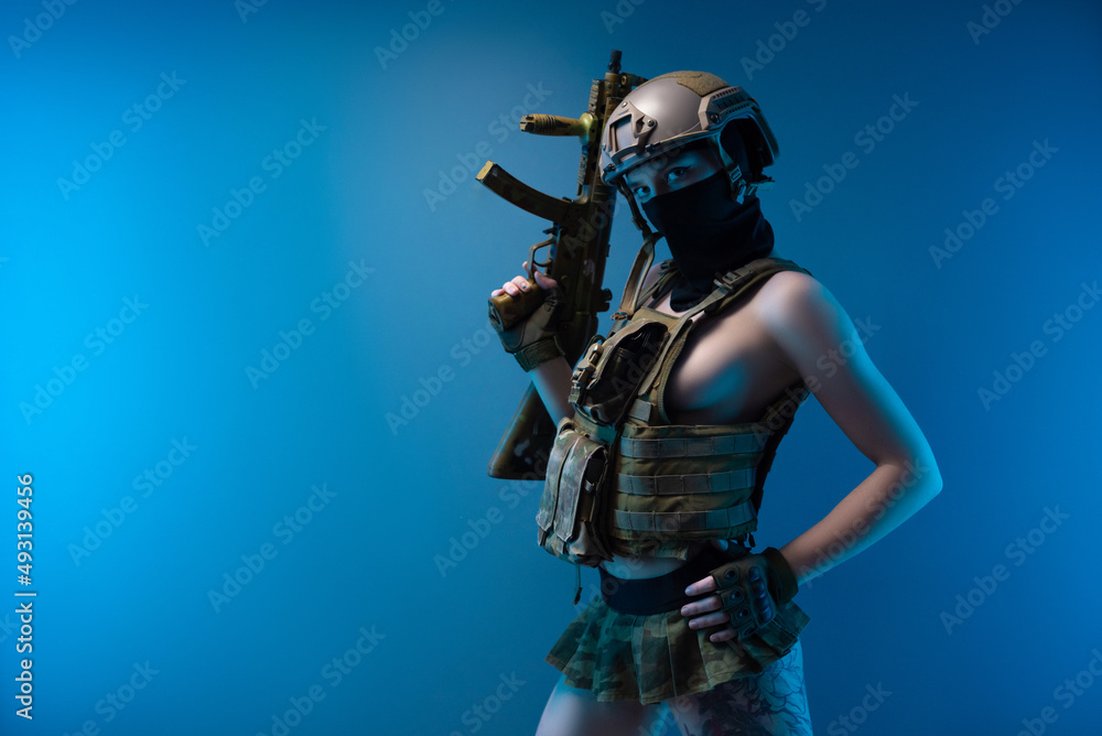 A Naked Girl Soldier In A Bulletproof Vest And Helmet Armed With An a-naked-girl-soldier-in-a-bulletproof-vest-and-helmet-armed-with-an