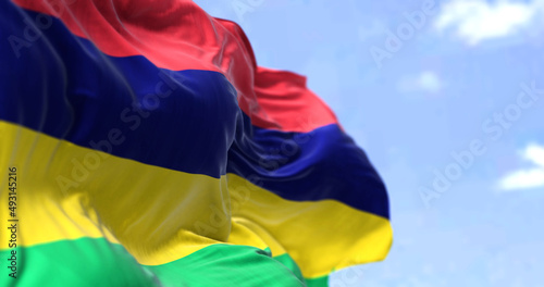 Detail of the national flag of Mauritius waving in the wind on a clear day