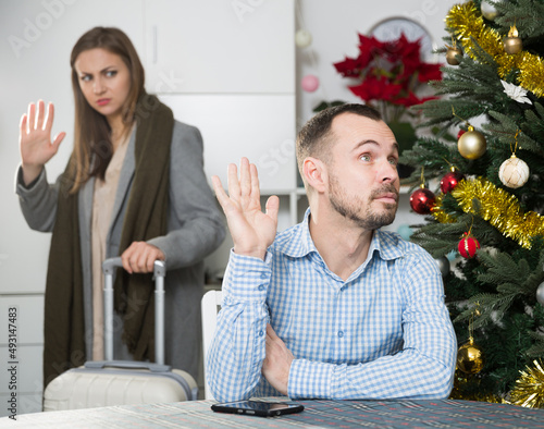 Husband offended wife because of her business trip on Christmas vacations photo