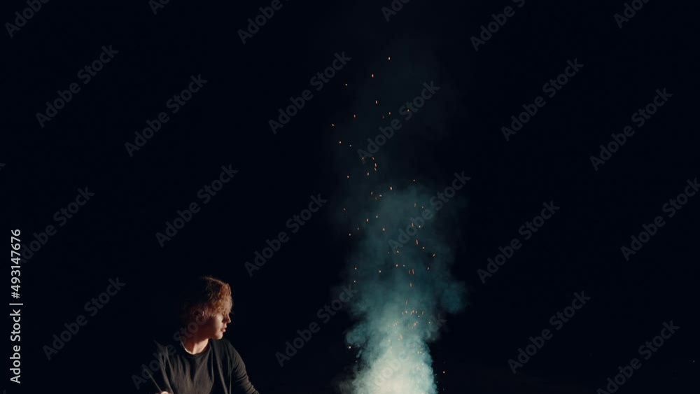 Man sitting by a campfire at night, fire, bonfire, looking at fire, dark midnight campfire bonfire Man sitting by a campfire at night, fire, bonfire, looking at fire, dark midnight campfire bonfire