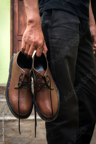 Dark brown 3-hole boots are handmade by local shoe craftsmen, these shoes look elegant and charming