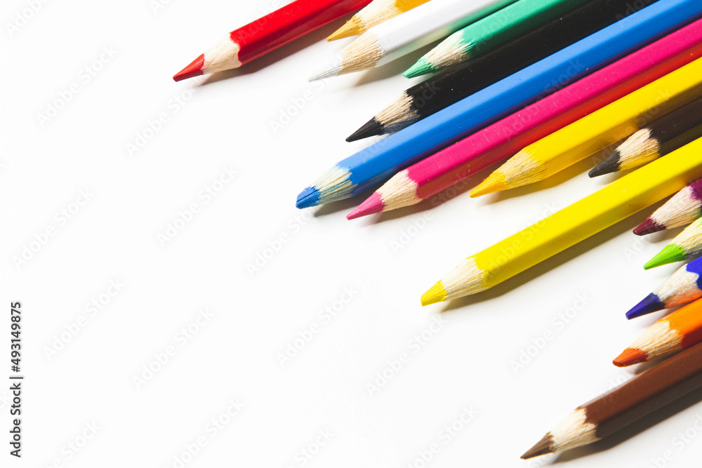 Obraz premium Colored pencils and white paper. Children's creativity. Template for drawing.