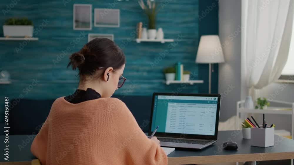 Student working form home on laptop to do internet research, learning college education on online class lesson. Woman doing homework assignment on notebook, taking notes and learning. Student working form home on laptop to do internet research, learning college education on online class lesson. Woman doing homework assignment on notebook, taking notes and learning.