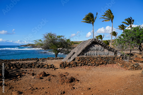Reconstructed Hawaiian Hale facing the Pacific Ocean in the ancient fishing village in ruins of the Lapakahi State Historical Park on the island of Hawai'i (Big Island) in the United States