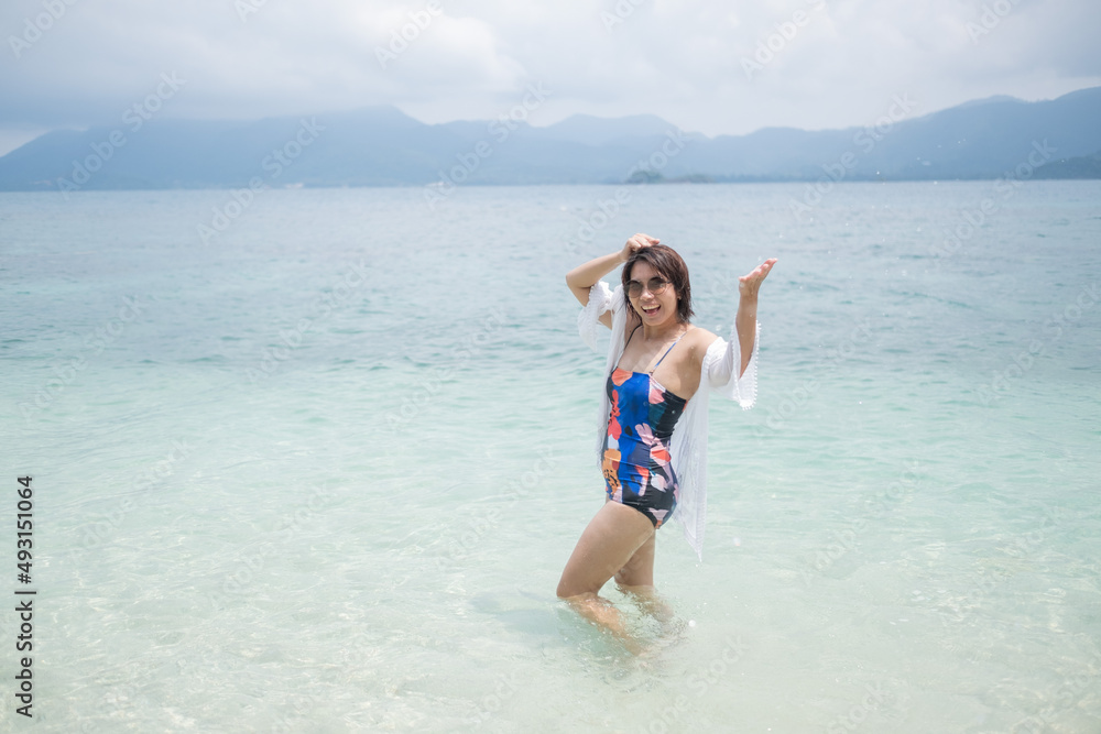 Portrait bikini girl with sea background, asian woman, beauty concept
