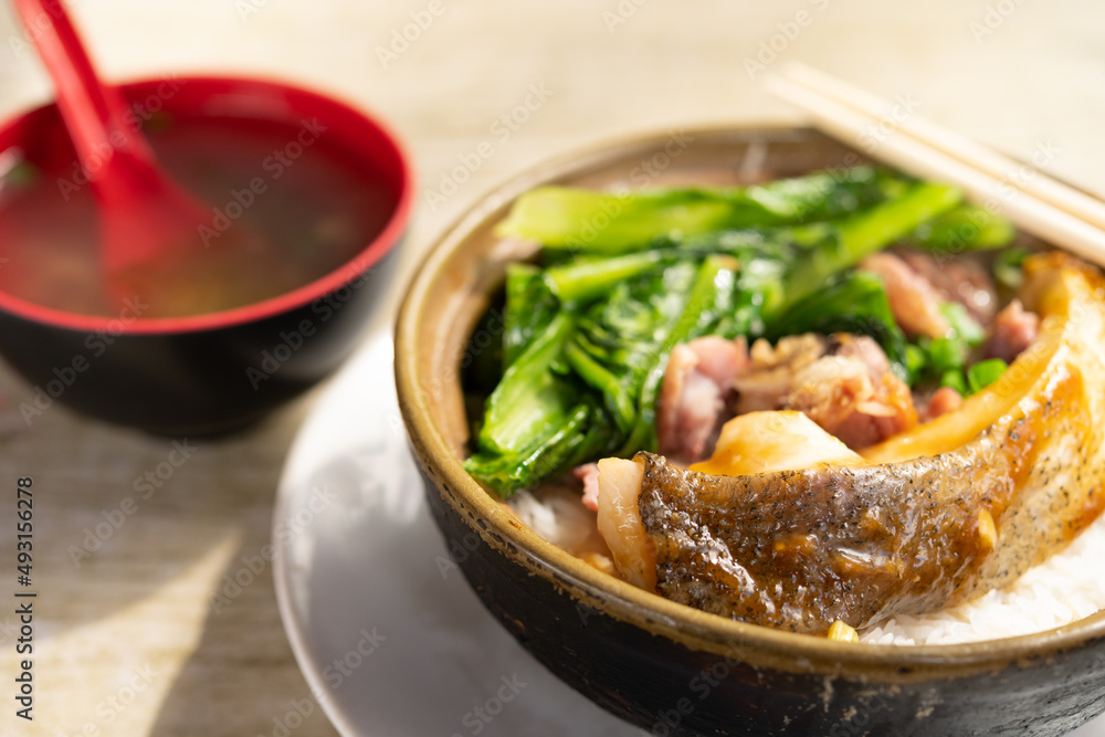 angle view clay pot rice with fish and pickled duck and vegetable angle view clay pot rice with fish and pickled duck and vegetable