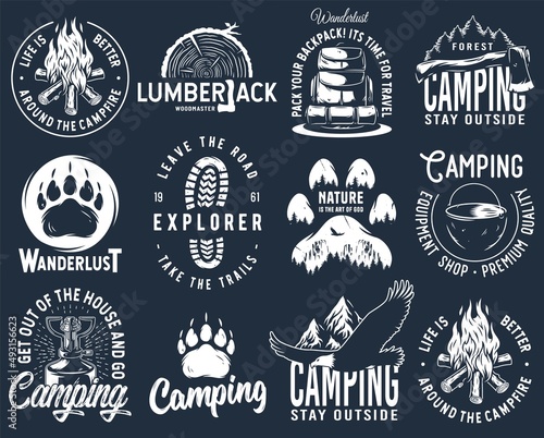 Set of monochrome camping and travel emblems, including campfire, flag, wood, lantern, forest