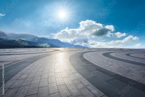 Empty square floor and green mountain with sky cloud landscape