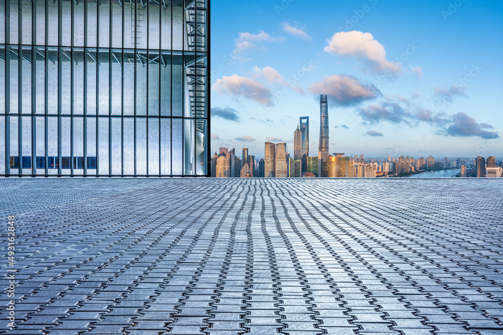 Fototapeta premium Empty square floor and city skyline with buildings in Shanghai at sunset, China.