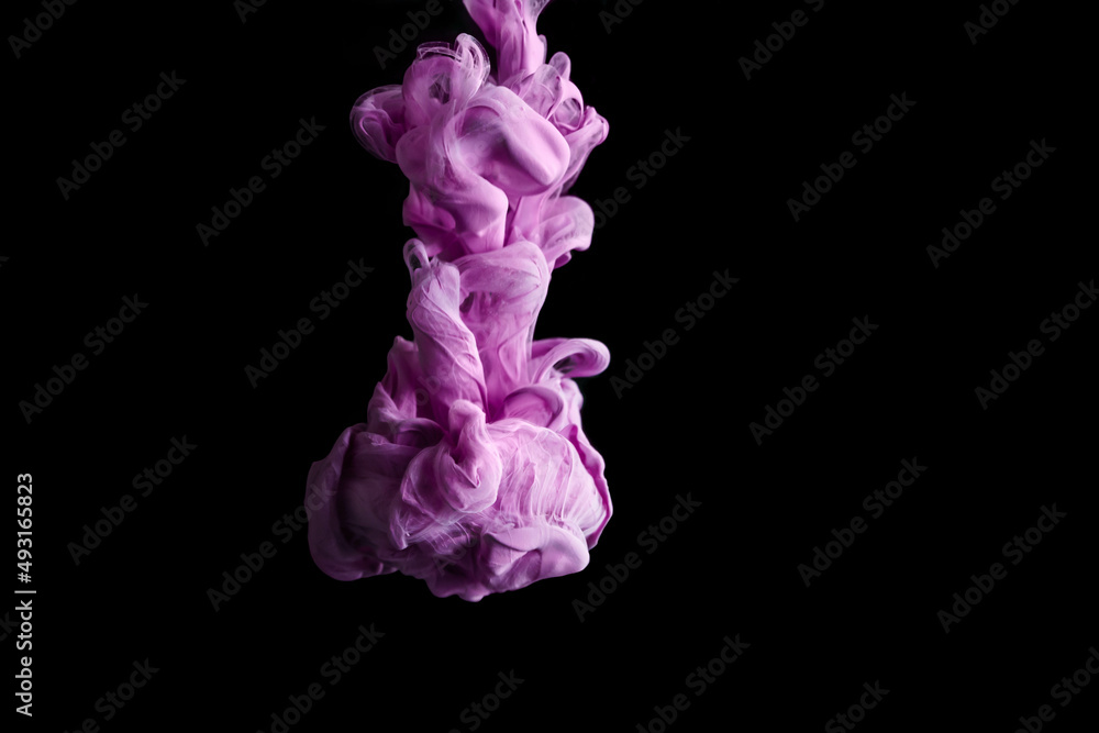 Purple colorful ink drop in water, Ink swirling in. abstraction image for background or color referent. Purple colorful ink drop in water, Ink swirling in. abstraction image for background or color referent.