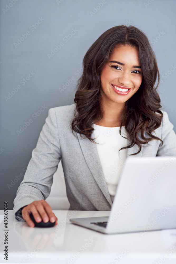 I do business with a positive attitude. Cropped portrait of a young businesswoman working on her laptop. I do business with a positive attitude. Cropped portrait of a young businesswoman working on her laptop.