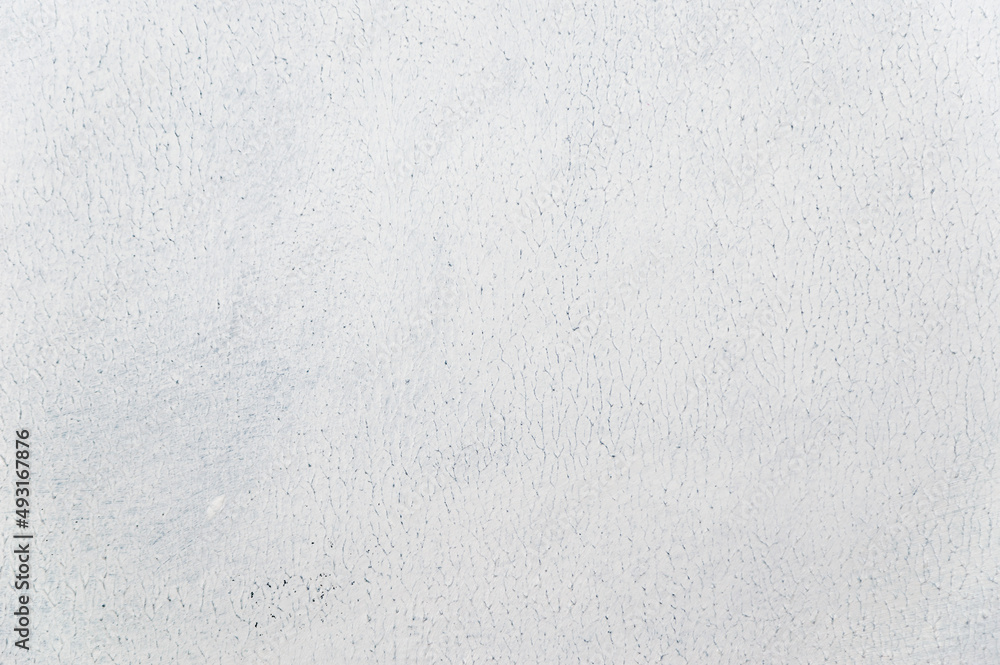 Obraz premium white uneven rough background with weak toning