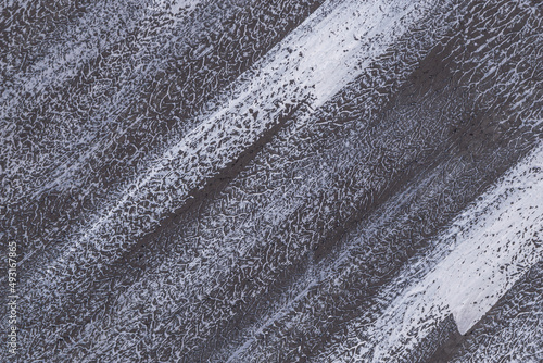 black and white striped uneven grungy background with weak toning