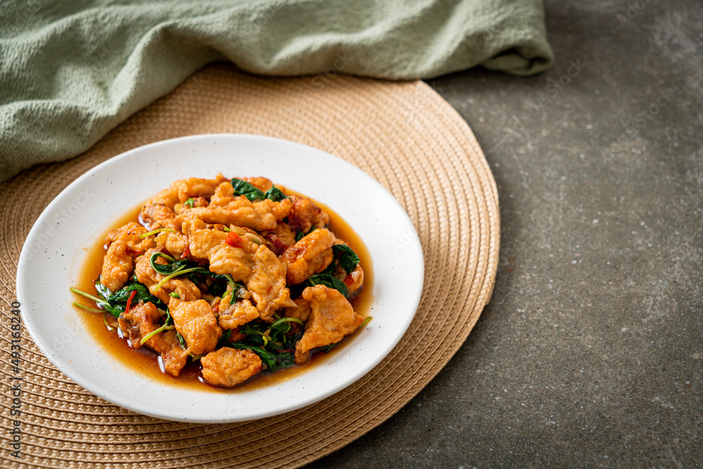 stir-fried fried fish with basil and chili in thai style stir-fried fried fish with basil and chili in thai style