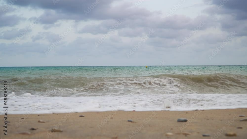 Waves washing ashore on a tropical beach with cloud blue skies and beautiful turquoise waters. Waves washing ashore on a tropical beach with cloud blue skies and beautiful turquoise waters.