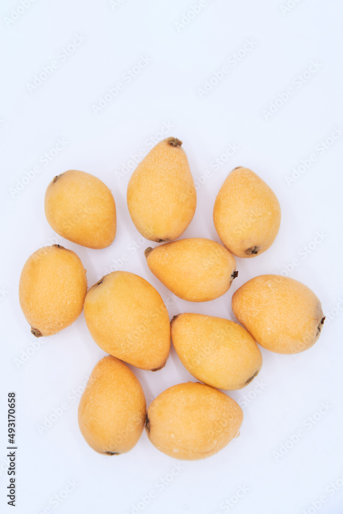 Ripe loquat on a white background