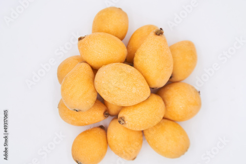 Ripe loquat on a white background