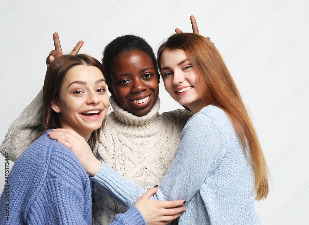 Multi-ethnic women with dark and white skin color female women portrait. Multi-ethnic women with dark and white skin color female women portrait.